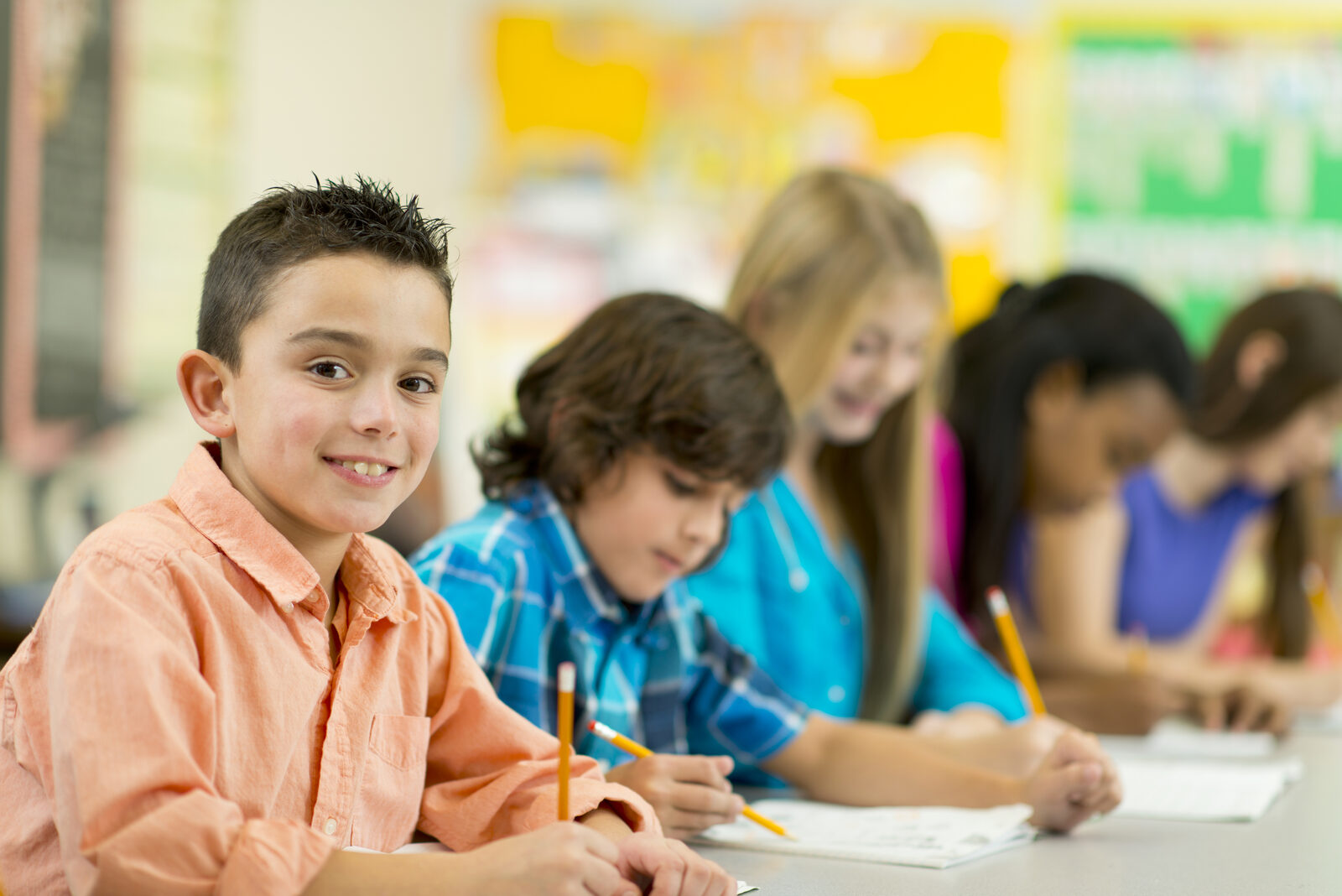 Elementary school students working together at their desks